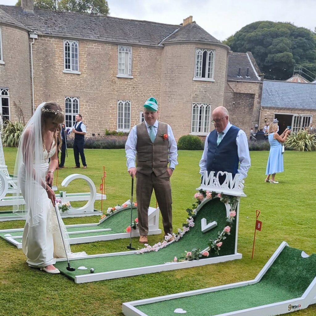 Guests playing wedding crazy golf at Cockliffe Country House