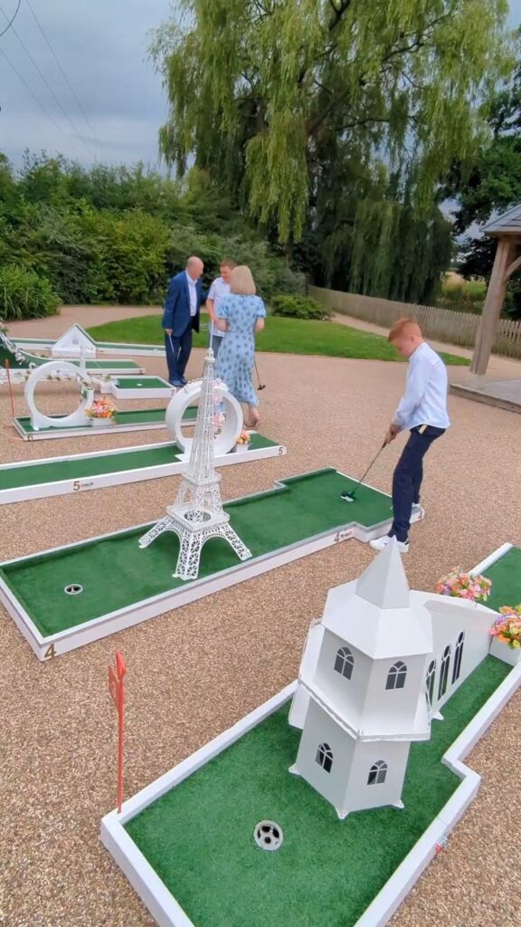 Guests playing wedding crazy golf at Hanbury Barns