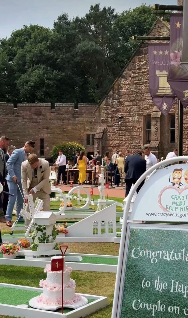 Guests playing wedding crazy golf at Peckforton Castle