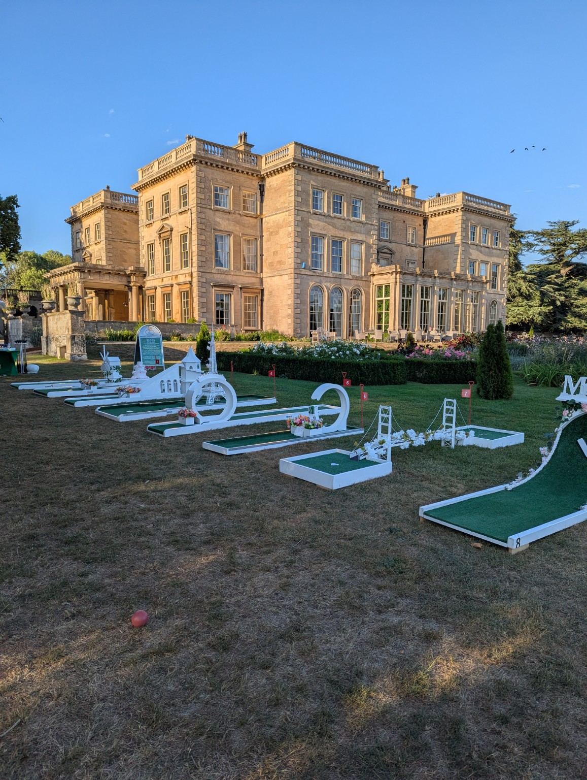 The Crazy Weds wedding crazy golf course at Prestwold Hall at golden hour
