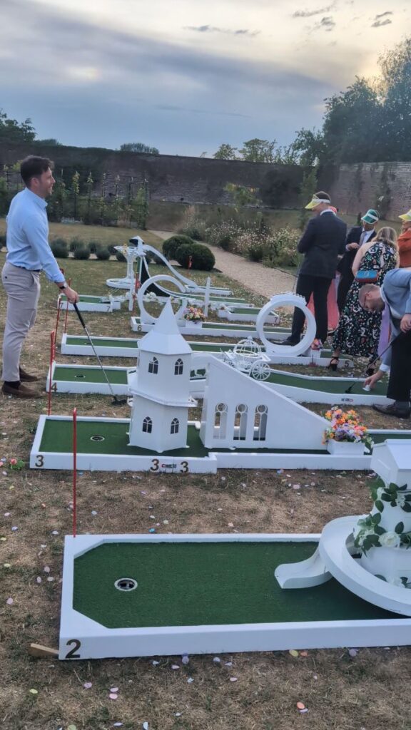 Wedding guests around the crazy golf course at Foxtail Barns, Staffordshire