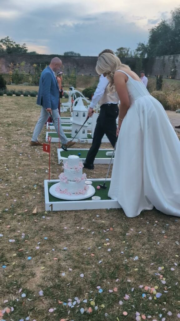 Bride and guests playing wedding crazy golf at Foxtail Barns