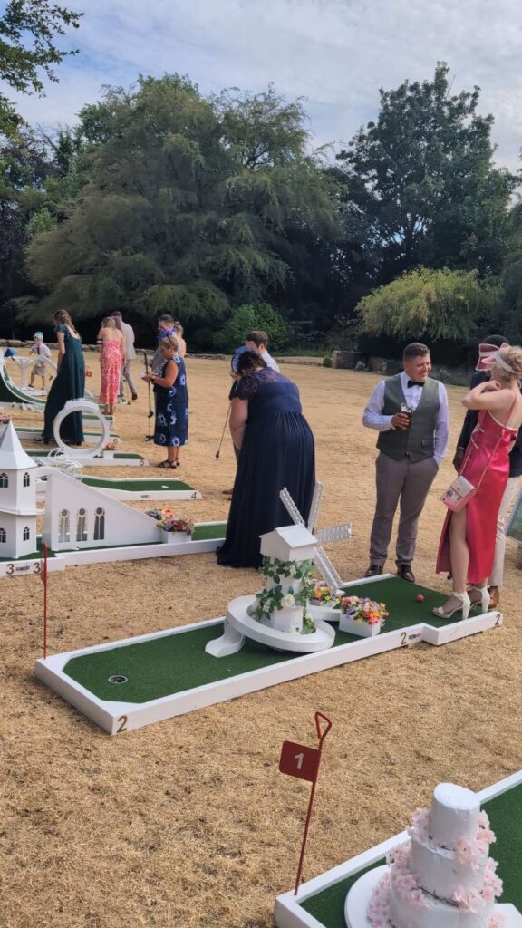 Wedding guests playing crazy golf on the lawn at Ringwood Hall Hotel & Spa