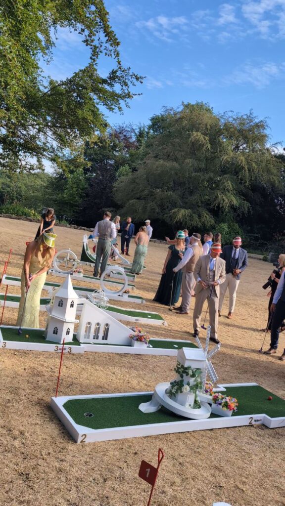 Wedding guests enjoying crazy golf in the gardens at Ringwood Hall Hotel, Derbyshire