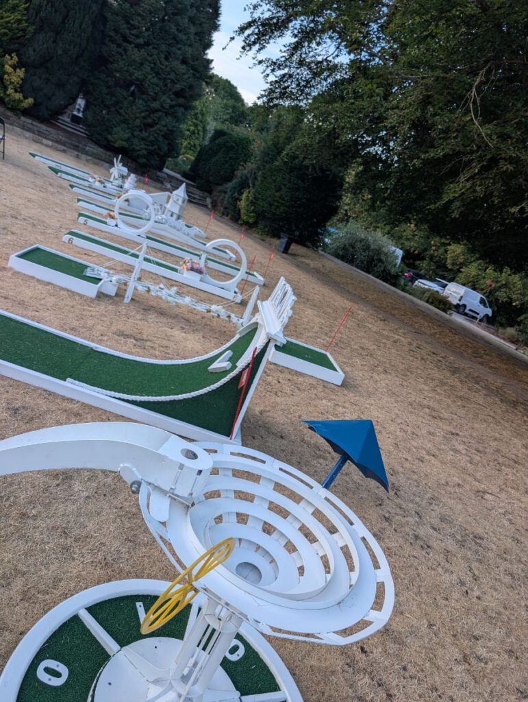 Crazy golf holes stretching across the lawn at Ringwood Hall, Brimington