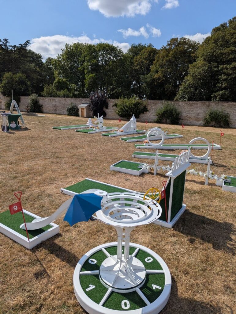 The Crazy Weds wedding crazy golf course on the lawn inside the old stone walls at Normanton Park Gardens