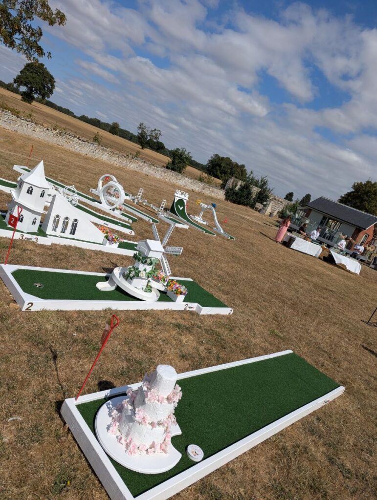 Wedding crazy golf holes laid out on the lawn at Normanton Park Gardens by Rutland Water