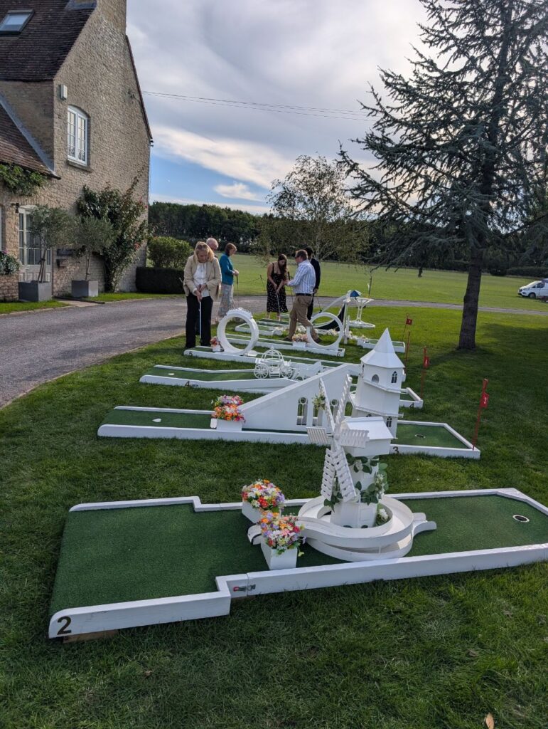 Guests arriving to play wedding crazy golf at Stratton Court Barn