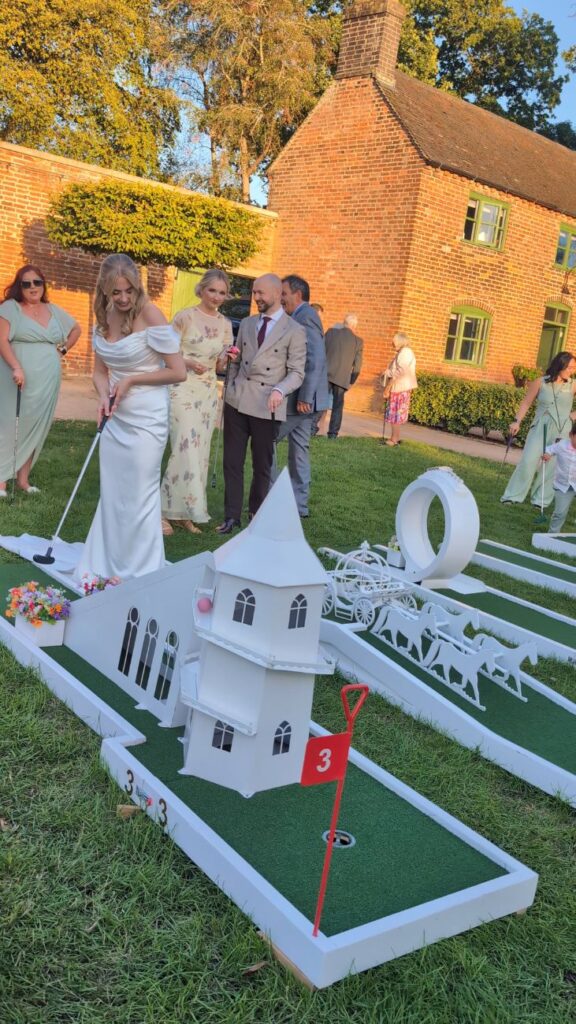 The Crazy Weds wedding crazy golf course on the lawn inside the walled garden at Thorpe Garden